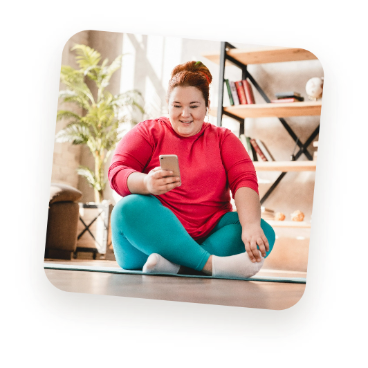 Woman using pilates app at home